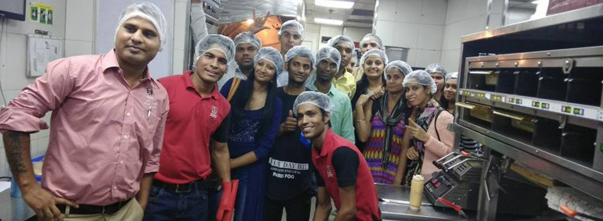 Header image showing beneficiaries of the Sai Swayam Society in a kitchen