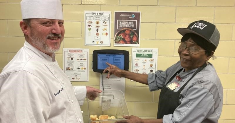 Compass chefs in the kitchen using Waste Not 2.0 food waste technology