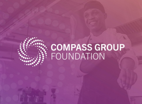 The Compass Group Foundation logo with a chef rolling up his sleeve behind