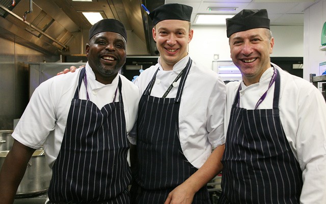 We are an enthusiastic team of food lovers teaser image showing three chefs smiling at the camera